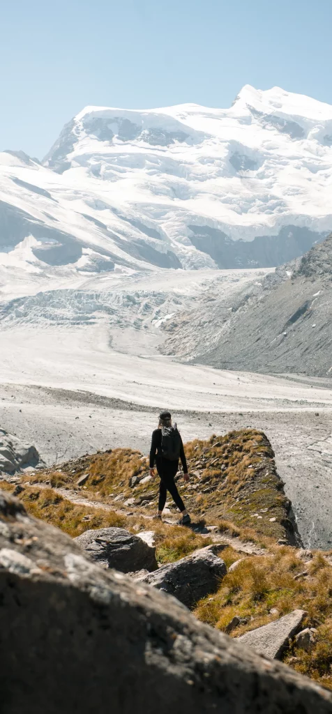 Hiker above the Val de Bagnes in summer