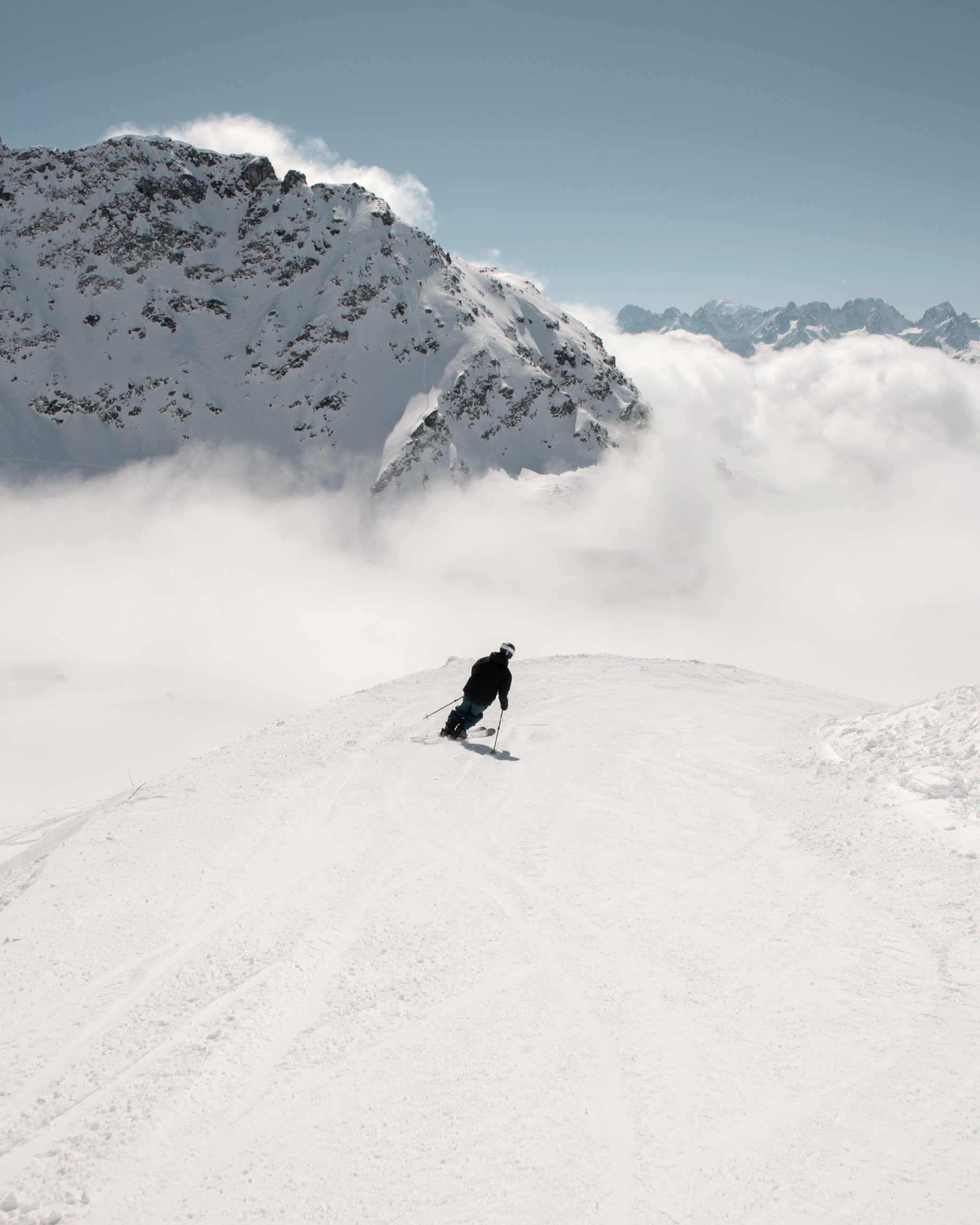 Skier carving down the slopes above Verbier